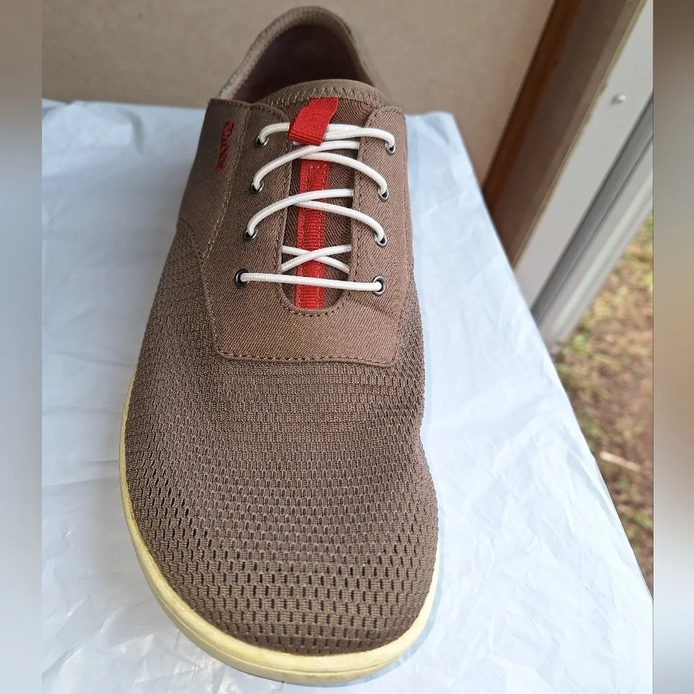 A pair of OluKai Nohea Moku mens shoes in a size 9M.They are pre-loved